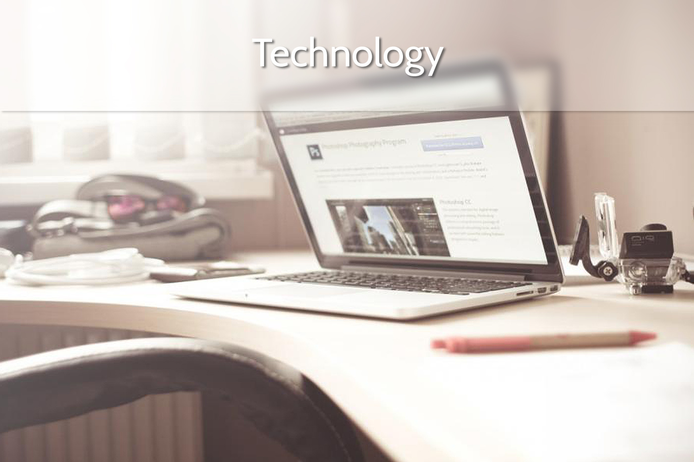 Technology, a laptop sitting at a desk illustrating the technology pepla uses (fullscreen laptop at desk frosted glass)